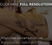 chi rho tattoo on forearm