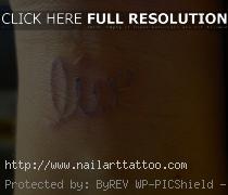 pale blue ink tattoo