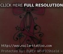 pink bow tattoos on hip