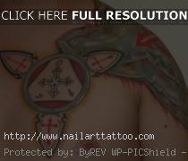 shoulder body armor tattoo