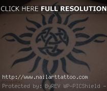 tribal celtic sun tattoos