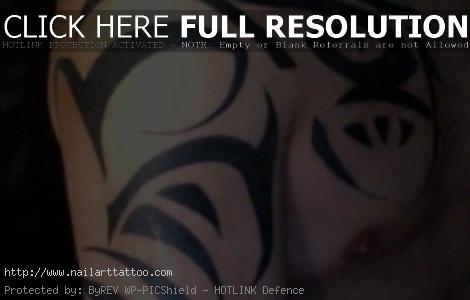 tribal chest shoulder tattoo