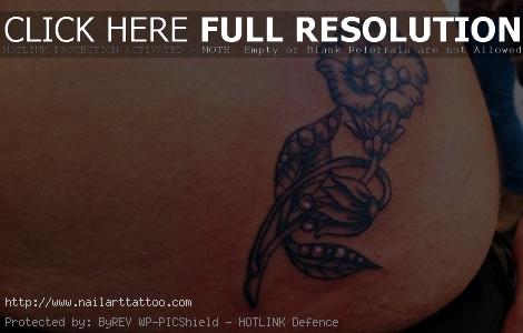 black and white flower hip tattoos