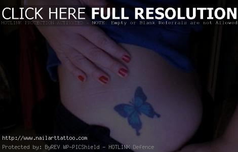 butterfly and flower rib tattoos