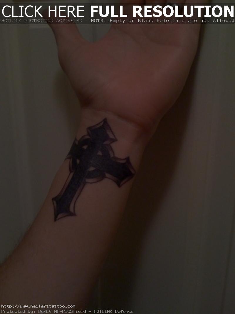 cross on wrist tattoo