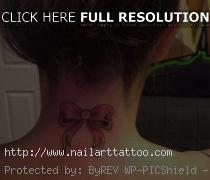 cross tattoo on back of neck