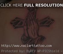 cross with praying hands tattoo