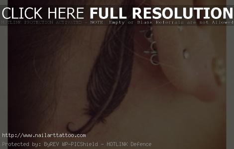 feather behind ear tattoo