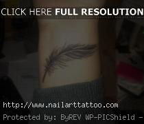 feather wrist tattoo