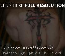 finger cross tattoo