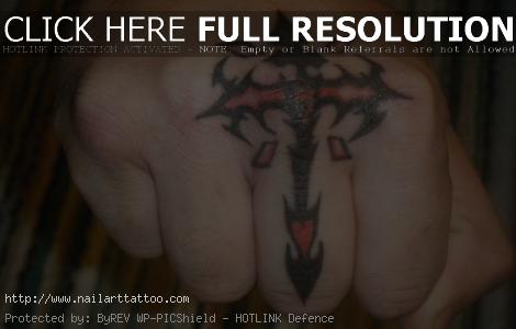 finger cross tattoo