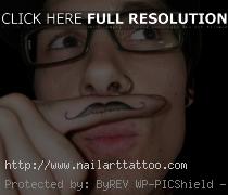 finger mustache tattoo