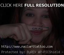 finger mustache tattoos