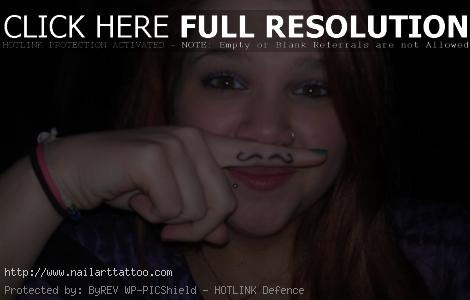 finger mustache tattoos