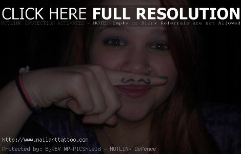 finger mustache tattoos