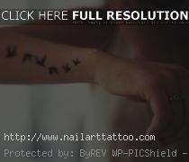 flock of birds tattoo on wrist