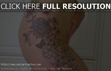 flower outline tattoo on arm
