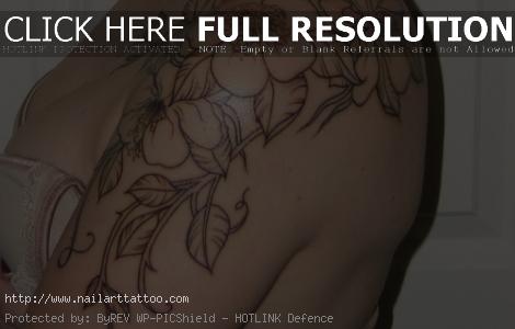 flower outline tattoo on shoulder