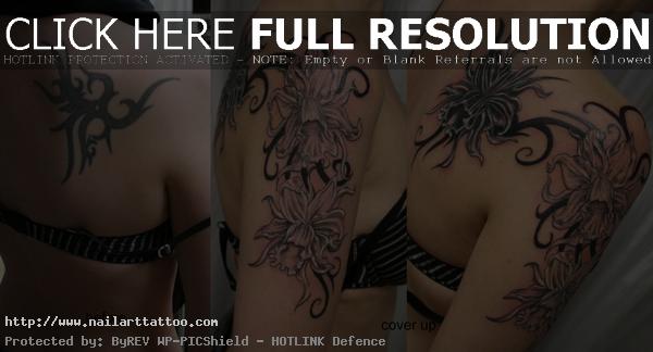 tribal flower cover up tattoos