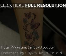 Piercing the butterfly tattoos with flowers design at a tattoo parlor