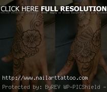 Cory Ferguson – flower hand tattoo