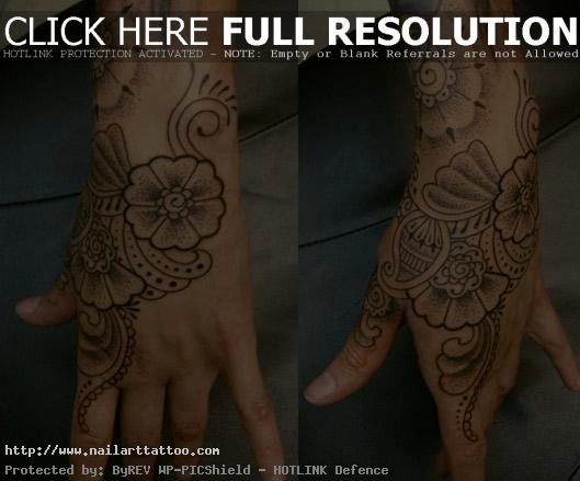 dotwork flower hand tattoo