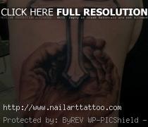 Hands with Cross Tattoo on Shoulder