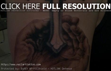 Hands with Cross Tattoo on Shoulder