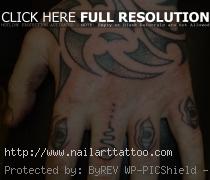 Maori-style tribal hand tattoos