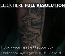 Skulls on forearm tattoo