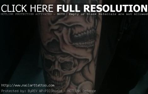 Skulls on forearm tattoo