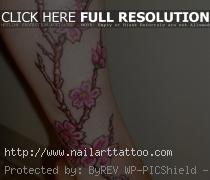 cherry blossom leg tattoo 15 Cherry Blossom Tattoo Designs