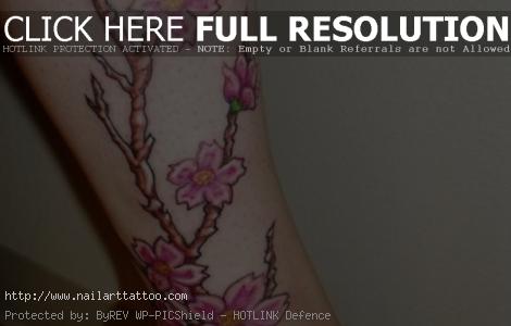 cherry blossom leg tattoo 15 Cherry Blossom Tattoo Designs
