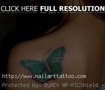 Light Blue Butterfly Tattoo On Shoulder